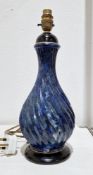 Holkham pottery blue simulated porphyry table lamp, of wrythen baluster form, impressed mark to
