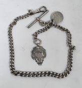 Silver curb-link watch chain hung with silver fob, total weight 41.7g approx  Condition Report