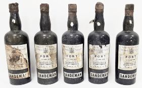 Five bottles of Sandeman 1945 vintage port, varying levels, labels present (5)  Provenance:  Hicks