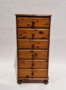 Modern pine tall chest of six drawers with pine knob handles, on bun feet, 123cm high x 58cm wide