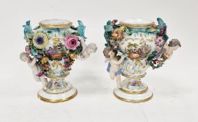 Matched pair of Meissen flower-encrusted inverted baluster vases, circa 1880, with blue cross swords