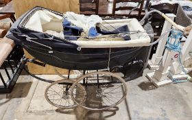 Mid-century London-style coach built pram made by The London Baby Coach Company, the blue folding