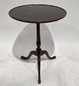 George III mahogany table, the circular single plank tray tilt-top on a turned baluster support
