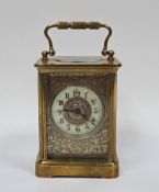 Brass carriage clock, the case with swing handle, the sides with bevelled glazed panels, the front