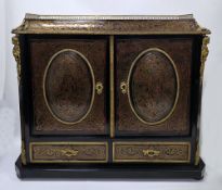 19th century French Boulle table cabinet, ebonised with tortoiseshell panels and brass inlay, the