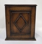 Early 20th century oak smoker's cabinet, the single door with beaded decoration opening to an