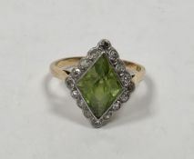 Art Deco18ct yellow gold and platinum peridot and diamond ring, the bezel set diamond cut peridot