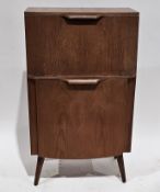 Mid-century Hubbinet teak drinks cabinet comprising a sloping drop-down door opening to an