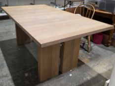 Modern oak extending dining table, the rectangular top with one additional leaf, on double block