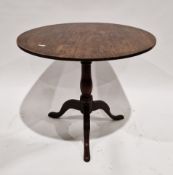 George III mahogany supper table, the circular top on turned baluster column and three outswept