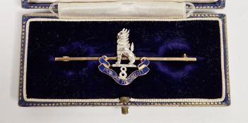 9ct gold military regimental bar brooch, set with a white metal lion with ruby eyes over an enamel