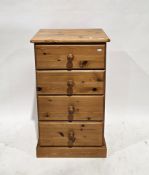 Modern pine chest of four short drawers, with pine knob handles, on plinth base, 95cm high x 55c