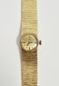 Lady's Omega 18ct gold bracelet watch, the small circular dial with baton markers and with