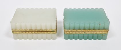 Two Continental opaque glass and gilt-metal mounted caskets, circa 1900, each of fluted