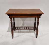 Late Victorian mahogany side table, the rectangular top on turned reeded tapering legs united by