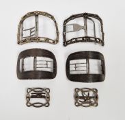 Two 18th century silver buckles, both bearing makers mark I.I, both of similar curved form decorated