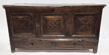 Early 18th century oak coffer, the hinged lid with thumbmoulded edge, the three-panel front inlaid