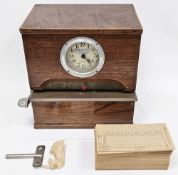 Early 20th century oak-cased clocking in machine by West Midland Time Recorders Limited, the white