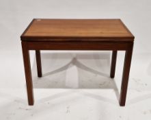 Mid-century teak foldover card/games table of rectangular form, the hinged lid folding to reveal a