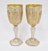 Pair of mid-19th century Bohemian gilt glass goblets, probably Moser, decorated in raised gilding