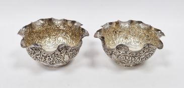 Pair of 19th century Indian white metal bowls, possibly Lucknow, of circular form with wavy rims,