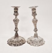 Pair of George III cast silver candlesticks probably by William Bennett, London 1810, with knopped
