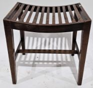 Early 20th century mahogany stool having a curved slatted seat, on square tapering legs united by