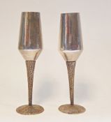 Pair of 20th century parcel-gilt silver champagne flutes by Stuart Devlin, London 1970, with