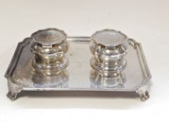 Edwardian silver desk inkstand by Carrington & Co, London 1906, of shaped rectangular form with