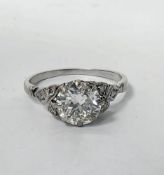 Platinum and diamond ring, the central claw-set diamond of approximately 1.5 carats (clarity