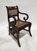 Regency mahogany metamorphic library elbow chair, the chair with bar back, bergere back panel and