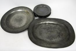 Collection of early 19th century pewter including 12 plates (25cm diameter), two chargers (46cm