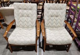 Pair of mid-century Parker Knoll Cintique armchairs, each having green and cream patterned back