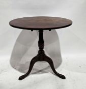 George III mahogany supper table, the circular top on a turned baluster support with three splayed