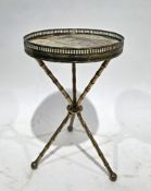 Mid-century brass tripod wine table, the circular onyx set top with pierced gallery rail, on three