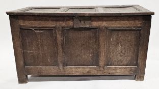 18th century oak coffer, the hinged three-panel top opening to an empty space, three-panel front, on