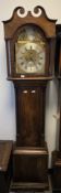 19th century eight-day longcase clock in mahogany case, the broken arch brass dial with roman
