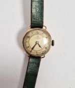 Lady's Omega 9ct gold strap watch with circular dial, on green leather strap (watch 10g approx)