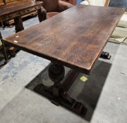 Oak refectory-style table in the 17th century manner, the rectangular top on carved cup and cover