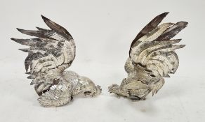 Pair of silver-plated models of fighting cockerels, probably continental (one foot a/f), 27cm high