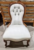 Victorian carved walnut framed salon chair, the balloon button back and seat upholstered in pale