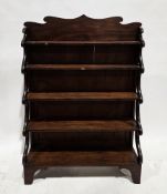 Early 19th century mahogany waterfall bookcase, with shaped top rail and scrolling supports to