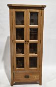 Modern pale oak display cabinet, the two doors with four bevelled edged glazed panels each,