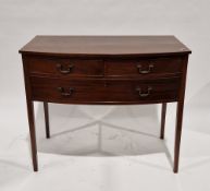 Mahogany bowfronted side table with two short and one long cockbeaded drawers having brass drop loop