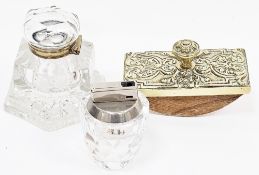 Early 20th century desk inkwell with brass collar, 10cm high, a brass-mounted desk blotter with