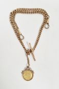 Edward VII gold half-sovereign 1910 in gold coin mount marked 9ct and hung on 9ct gold curb-link