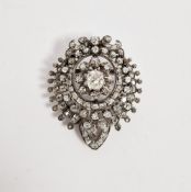 Early 20th century French white metal and diamond target brooch, the central old cut diamond