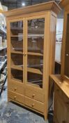 M&S Home Light pale oak display cabinet having two glazed doors opening to three shelves, over