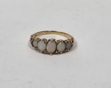 Yellow gold (hallmarks rubbed) and opal ring, comprising a row of five precious oval graduating