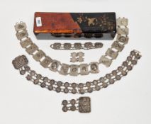 Chinese silver-coloured necklace of five rectangular embossed panels and a fancy oval link chain,